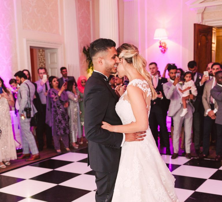 Bride and Groom Enjoying Their First Dance Together