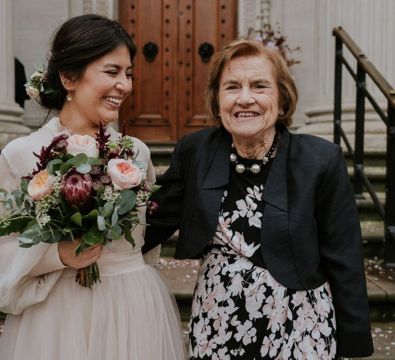 Bride in tulle skirt bridal separates with wedding guest