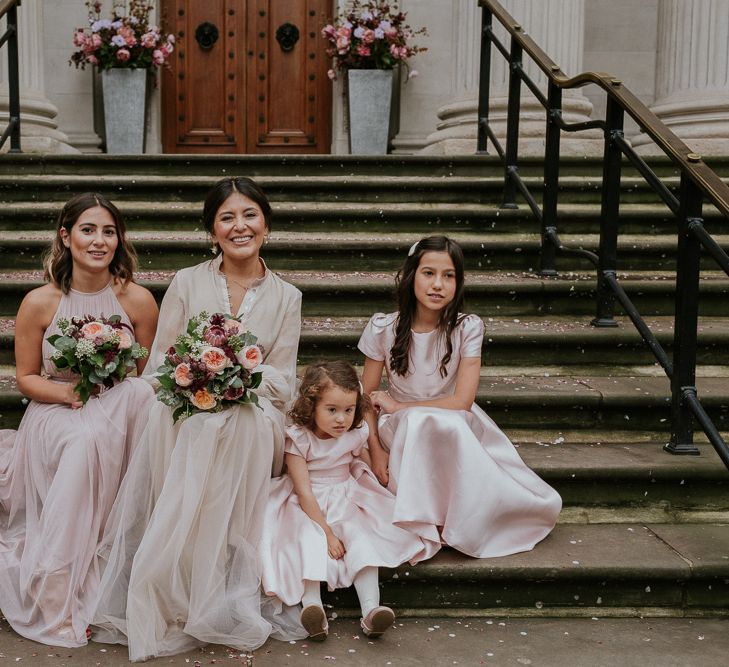 Bridal party at intimate London wedding with bride in tulle skirt