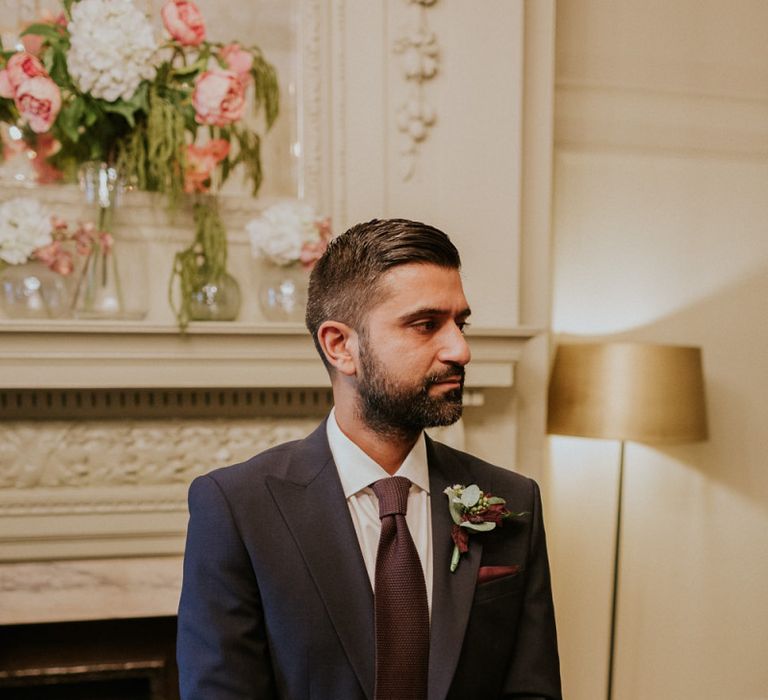 Groom in navy suit at town hall wedding