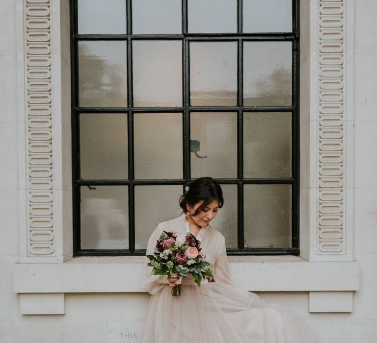 Bride in blush tulle skirt and top bridal separates