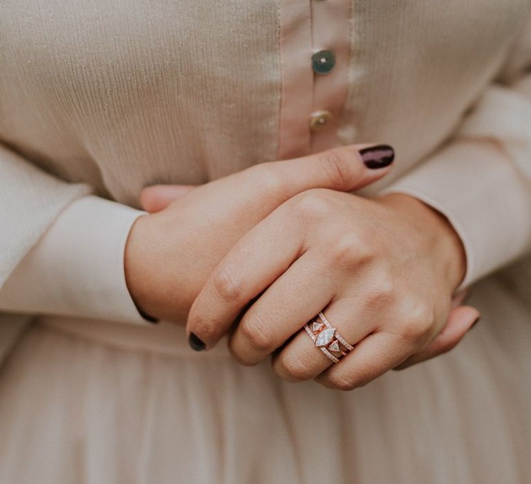 Ornate wedding ring and burgundy wedding nails