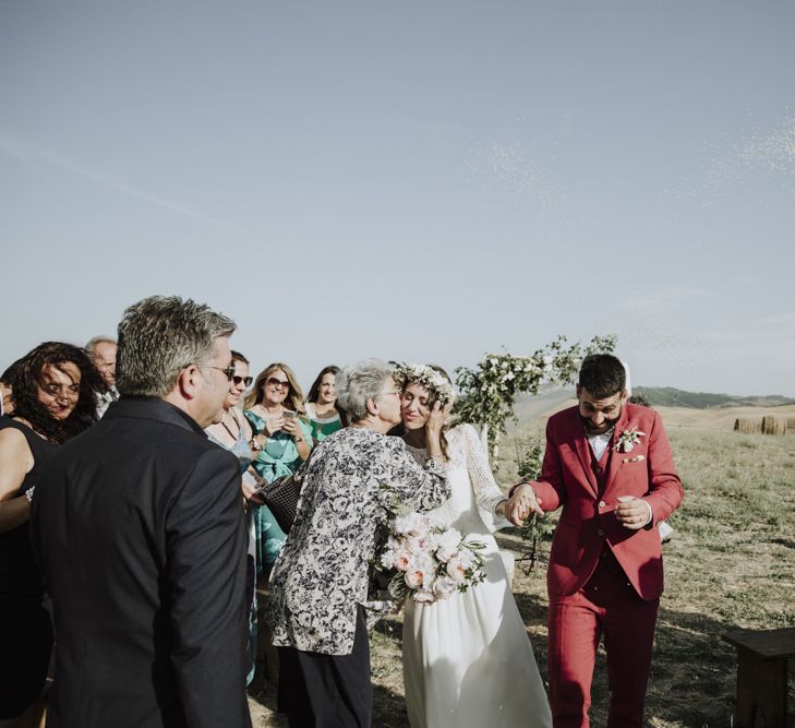 Bride in Laure de Sagazan wedding dress during ceremony