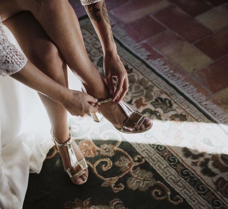 Gold wedding shoes with Laure de Sagazan bride dress