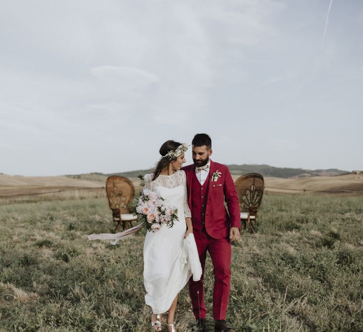 Red wedding suit for groom with Laure de Sagazan bride dress