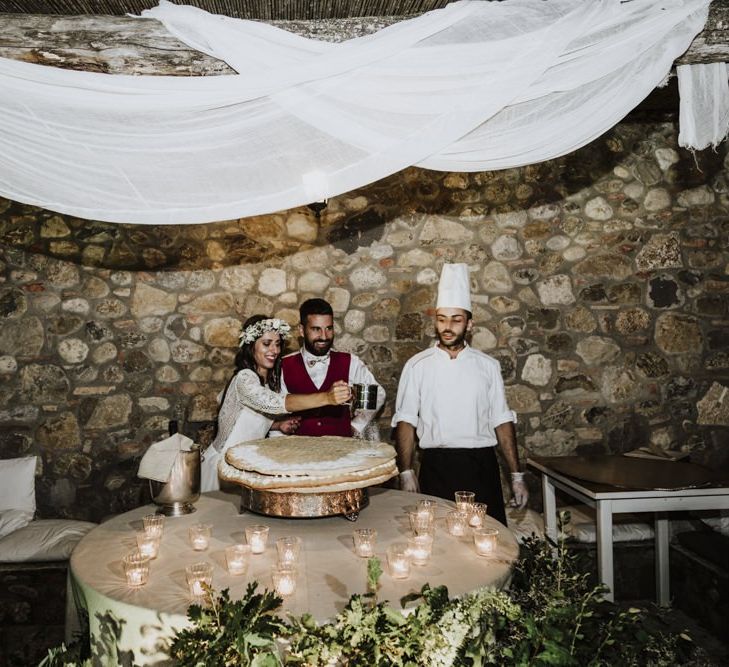 Bride and groom cut the wedding cake