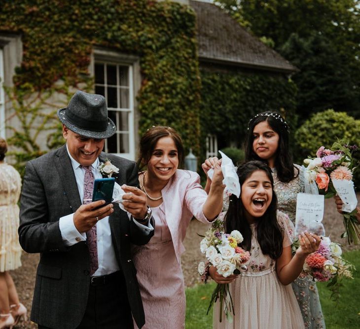 Brides family throwing confetti