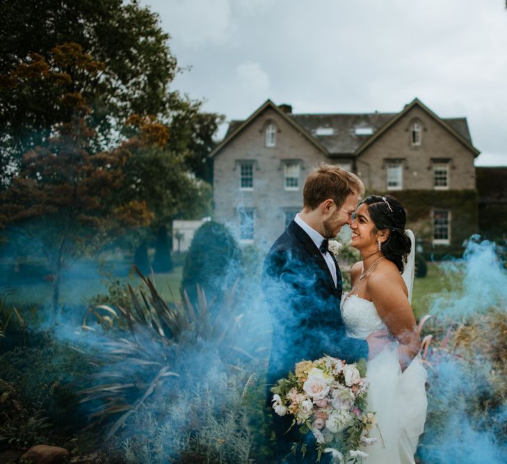 Bride and groom smoke bomb portrait at Lemore Manor