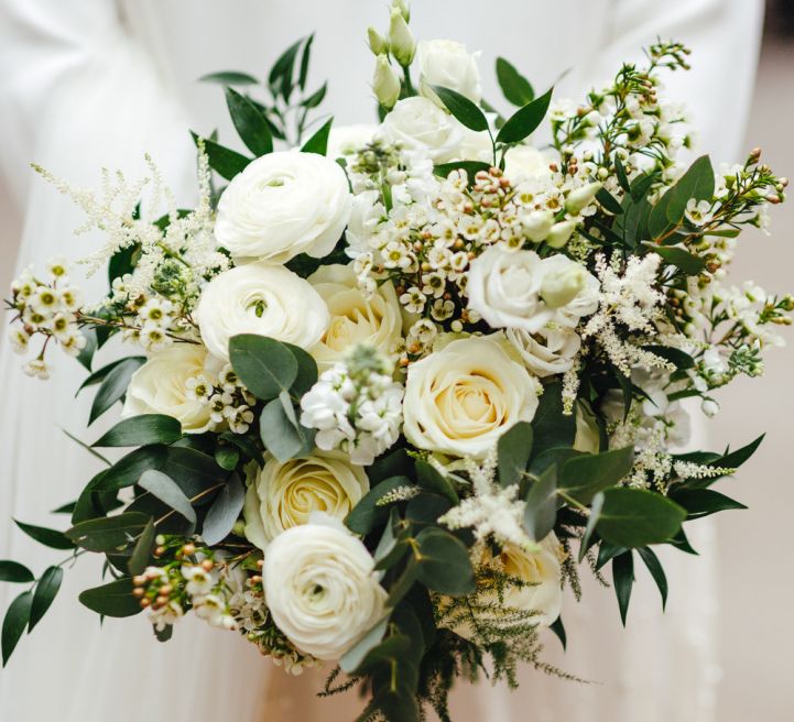 White rose and foliage bridal bouquet at spring wedding