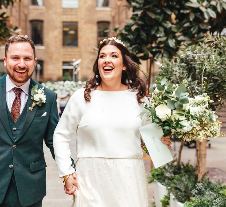 Confetti shot for spring wedding at Devonshire Terrace with white floral decor