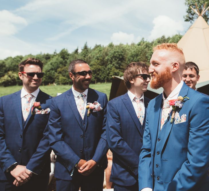 Groom at the altar in Navy Suit | Bright Festival Themed Outdoor Ceremony &amp; Tipi Weeding |  Maryanne Weddings | Framed Beauty Film