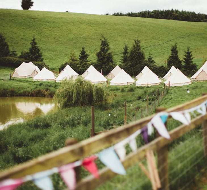 Bell Tent Glamping Field | Bright Festival Themed Outdoor Ceremony &amp; Tipi Weeding |  Maryanne Weddings | Framed Beauty Film