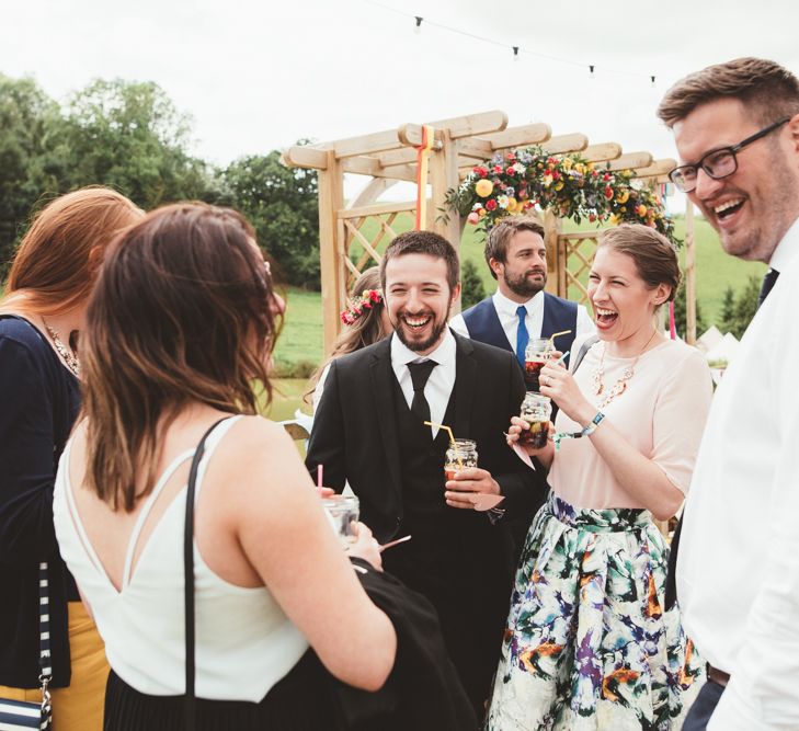 Wedding Guests | Bright Festival Themed Outdoor Ceremony &amp; Tipi Weeding |  Maryanne Weddings | Framed Beauty Film