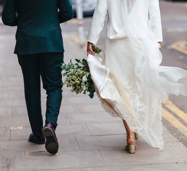 Bride wearing Gucci shoes and two piece bridal dress