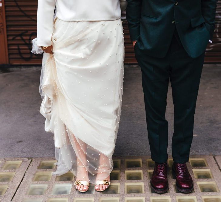 Brides Gucci shoes and groom wearing burgundy brogues