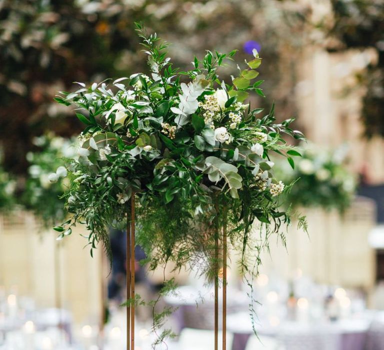 Devonshire Terrace courtyard reception with raised foliage table arrangements and candles