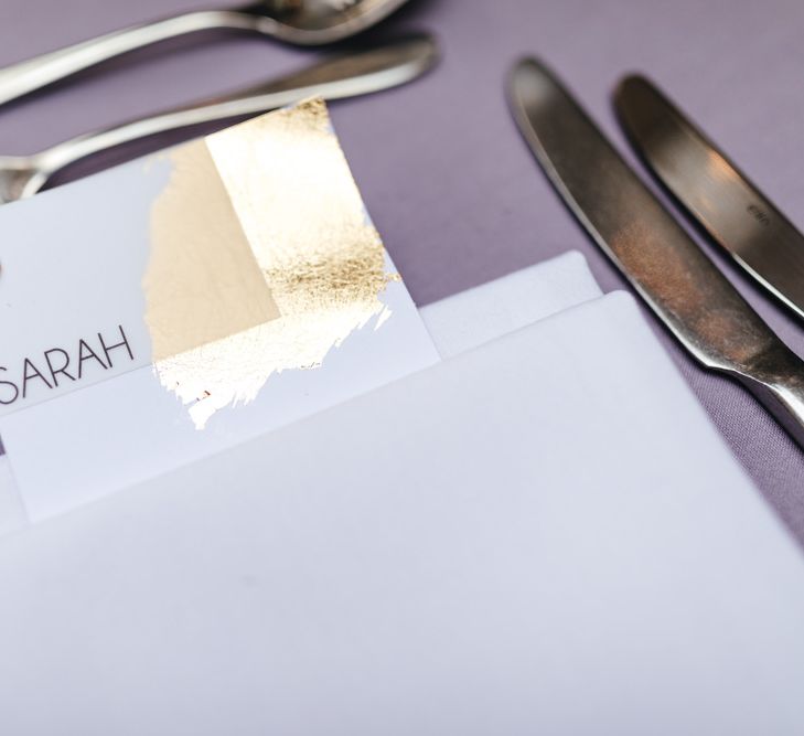 Lilac tablecloth with gold foiling place settings