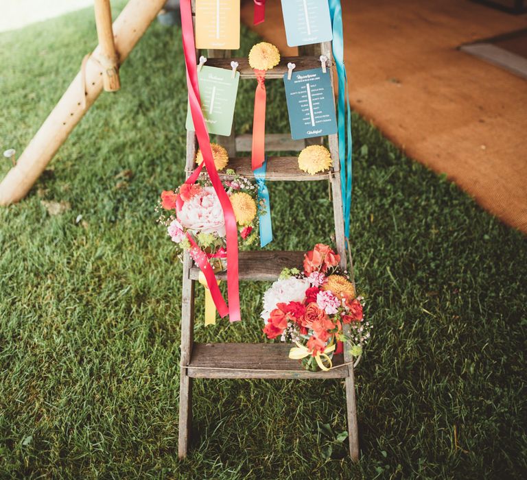 Vintage Step Ladder Table Plan | Bright Festival Themed Outdoor Ceremony &amp; Tipi Weeding |  Maryanne Weddings | Framed Beauty Film