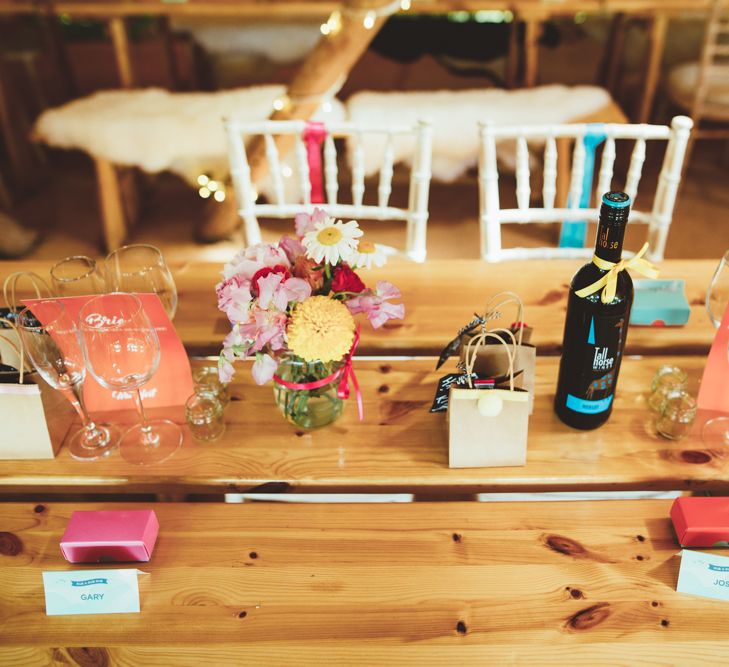 Table Decor with Flower Stems in Jars | Bright Festival Themed Outdoor Ceremony &amp; Tipi Weeding |  Maryanne Weddings | Framed Beauty Film