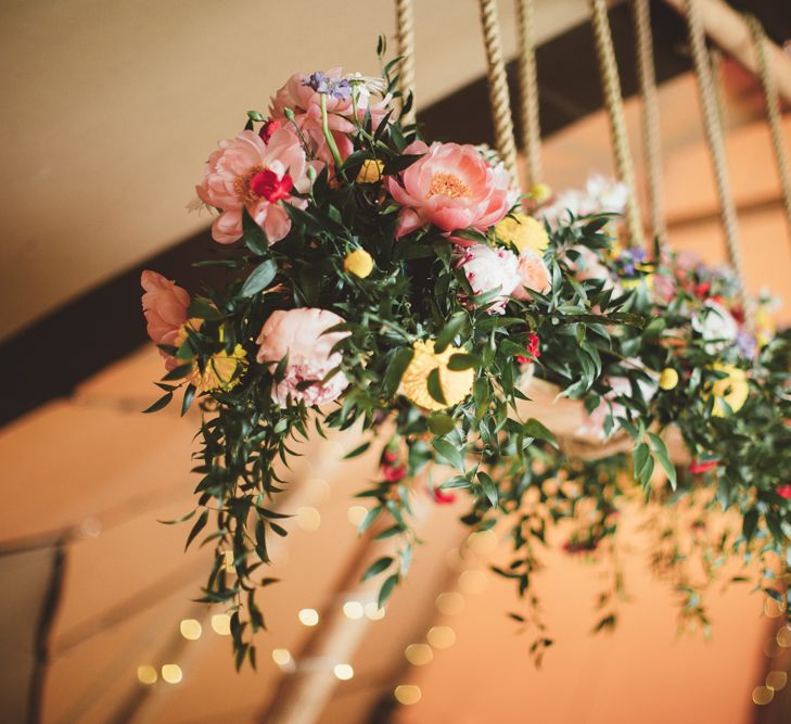 Floral Hanging Installation with Peonies | Bright Festival Themed Outdoor Ceremony &amp; Tipi Weeding |  Maryanne Weddings | Framed Beauty Film