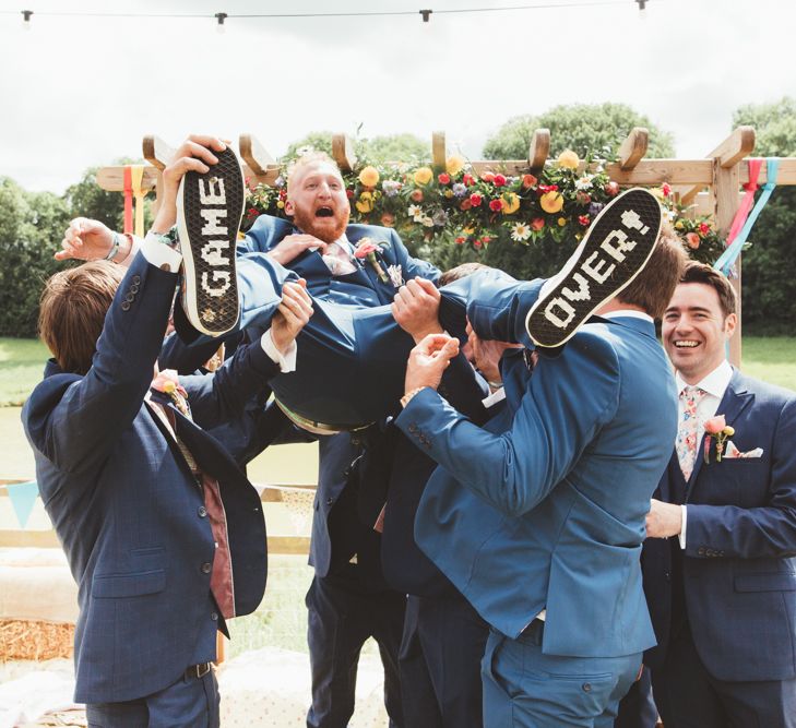 Groomsmen in Navy Suits | Groom in Vans with Game Over Soles | Bright Festival Themed Outdoor Ceremony &amp; Tipi Weeding |  Maryanne Weddings | Framed Beauty Film