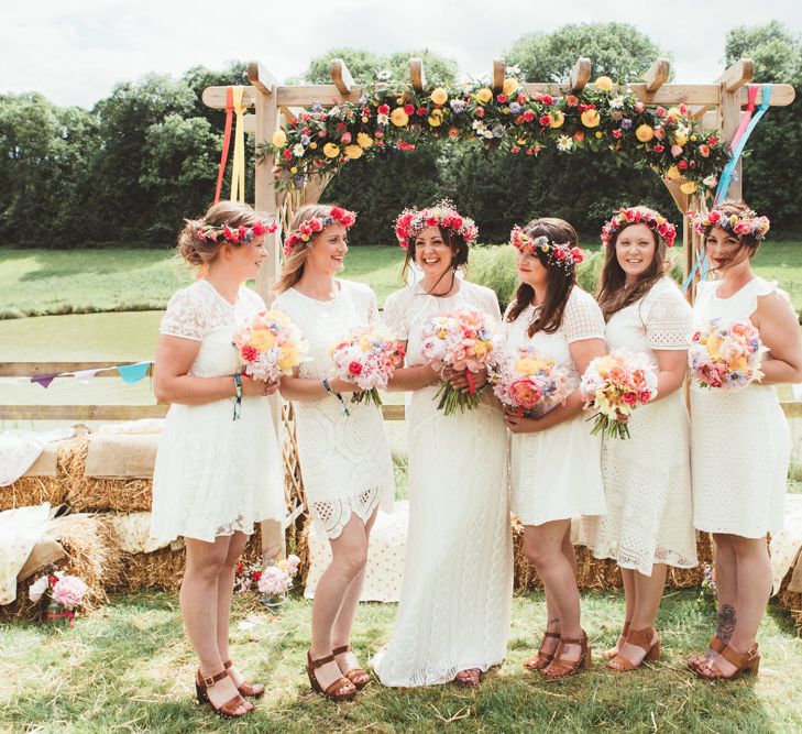 Bridal Party | Flower Crowns | Bridesmaids in Different White Dresses | Bride in Watters Gown | Bright Festival Themed Outdoor Ceremony &amp; Tipi Weeding |  Maryanne Weddings | Framed Beauty Film