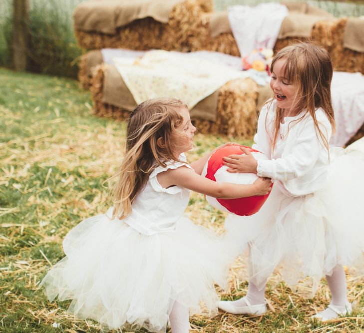 Flower Girls in Monsoon Kids Tutus | Bride in Lace Watters Gown &amp; Colourful Flower Crown | Groom in Navy Suit | Bright Festival Themed Outdoor Ceremony &amp; Tipi Weeding |  Maryanne Weddings | Framed Beauty Film