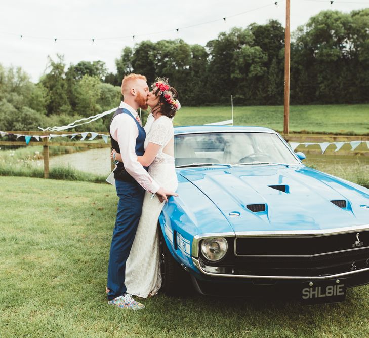 Bride in Lace Watters Wedding Dress | Groom in Navy Suit | Bright Festival Themed Outdoor Ceremony &amp; Tipi Weeding |  Maryanne Weddings | Framed Beauty Film