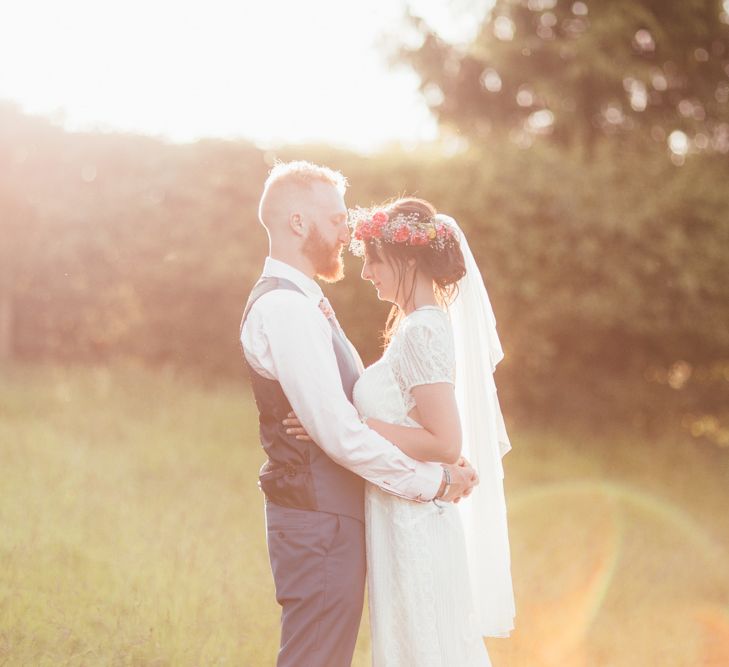 Bride in Lace Watters Wedding Dress | Groom in Navy Suit | Bright Festival Themed Outdoor Ceremony &amp; Tipi Weeding |  Maryanne Weddings | Framed Beauty Film