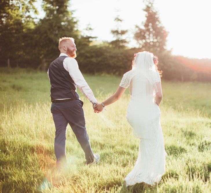 Bride in Lace Watters Wedding Dress | Groom in Navy Suit | Bright Festival Themed Outdoor Ceremony &amp; Tipi Weeding | Maryanne Weddings | Framed Beauty Film