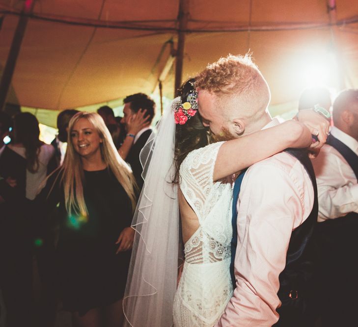 Bride in Lace Watters Wedding Dress | Groom in Navy Suit | Bright Festival Themed Outdoor Ceremony &amp; Tipi Weeding | Maryanne Weddings | Framed Beauty Film