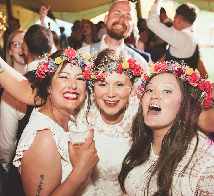 Bridesmaids in White Dresses &amp; Colourful Flower Crowns | Bright Festival Themed Outdoor Ceremony &amp; Tipi Weeding | Maryanne Weddings | Framed Beauty Film