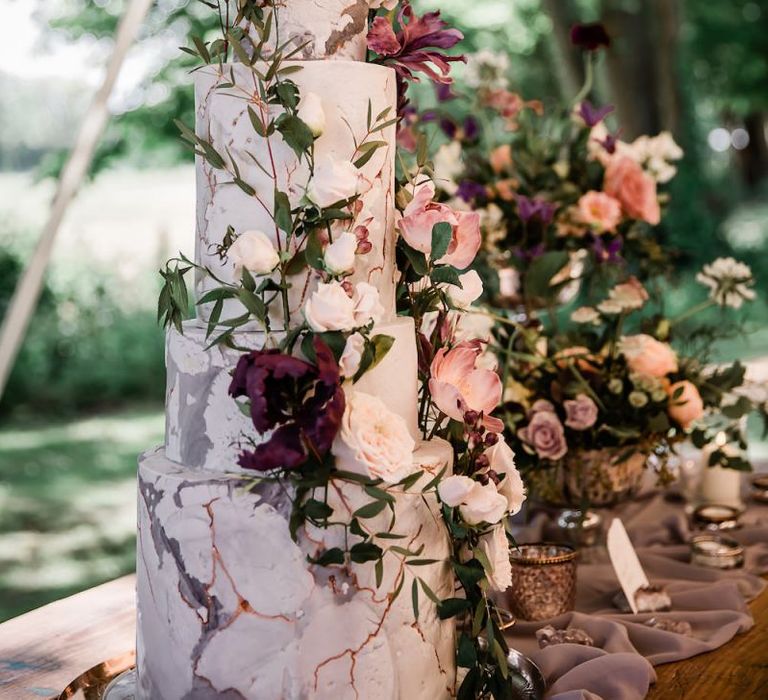 Four Tier Marble Wedding Cake Decorated with Wedding Flowers