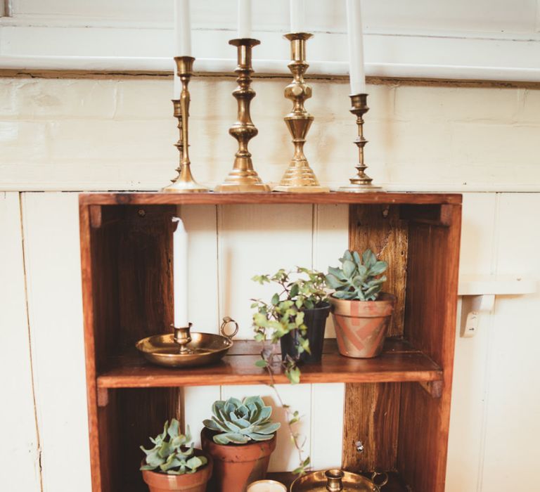 Wooden Shelf with Succulent Plant Pots and Gold Candle Sticks