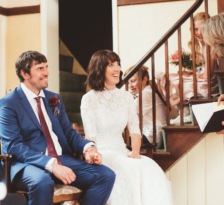 Bride in Lace Wedding Dress from Hope &amp; Harlequin and Groom in  Navy Hugo Boss Suit