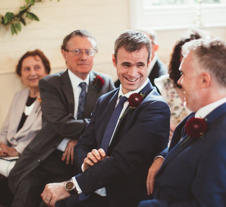 Groomsmen Laughing During The Wedding Ceremony