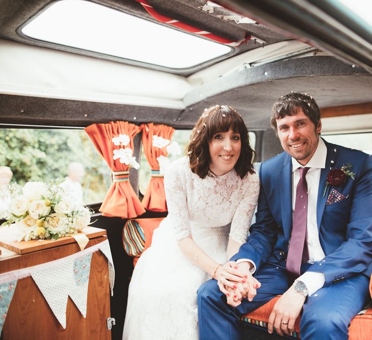 Bride in Lace Wedding Dress from Hope &amp; Harlequin and Groom in Navy Hugo Boss Suit  Sitting in VW Camper Van Wedding Car