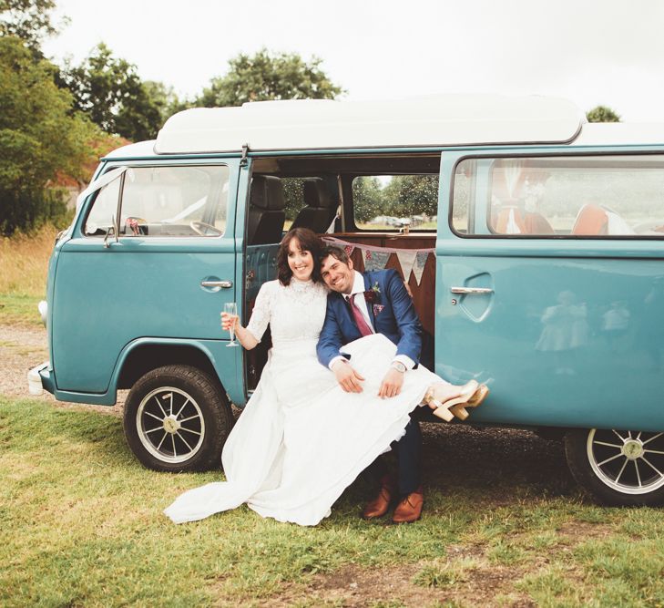 Bride in Lace Wedding Dress from Hope &amp; Harlequin and Groom in Navy Hugo Boss Suit in VW Camper Van