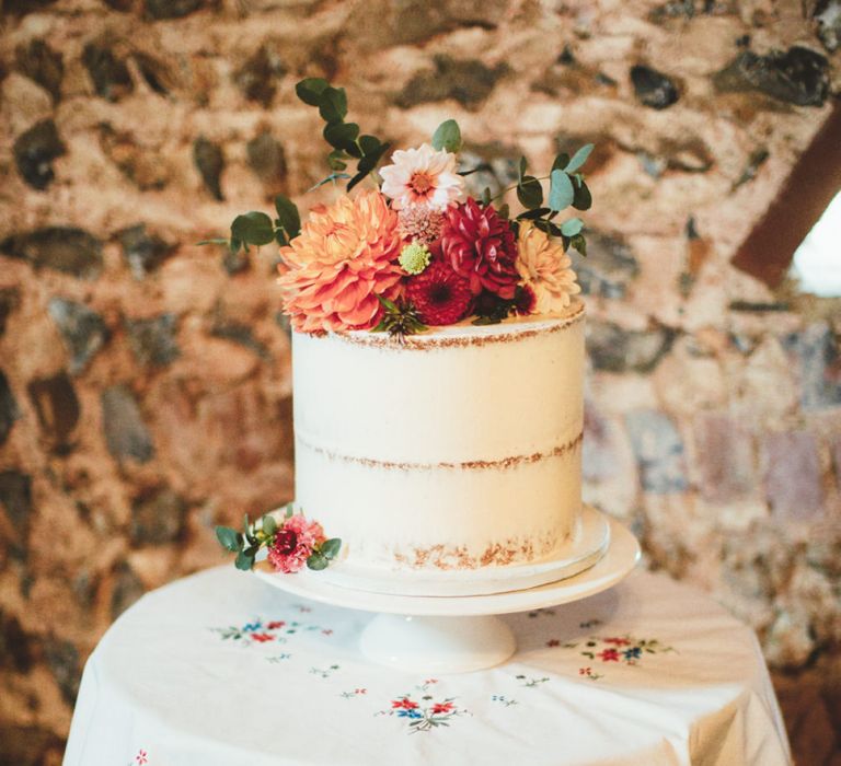 Single Tier Semi Naked Wedding Cake with Bright Dahlia  Fresh Flower Topper