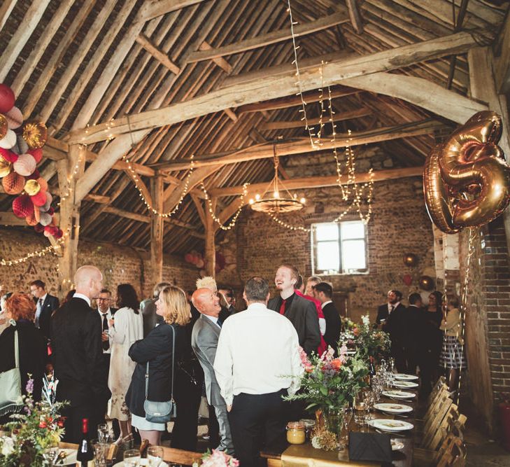 Montague Farm Barn Wedding Reception Decor with Pom Pom Arch, Fairy Lights and Balloon Wedding Decor