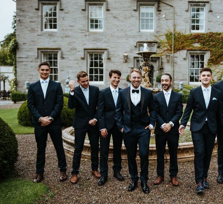 Groomsmen in navy suits