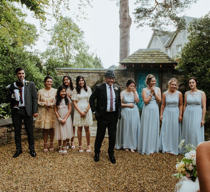 Bridal party first look with Father of the bride in hat