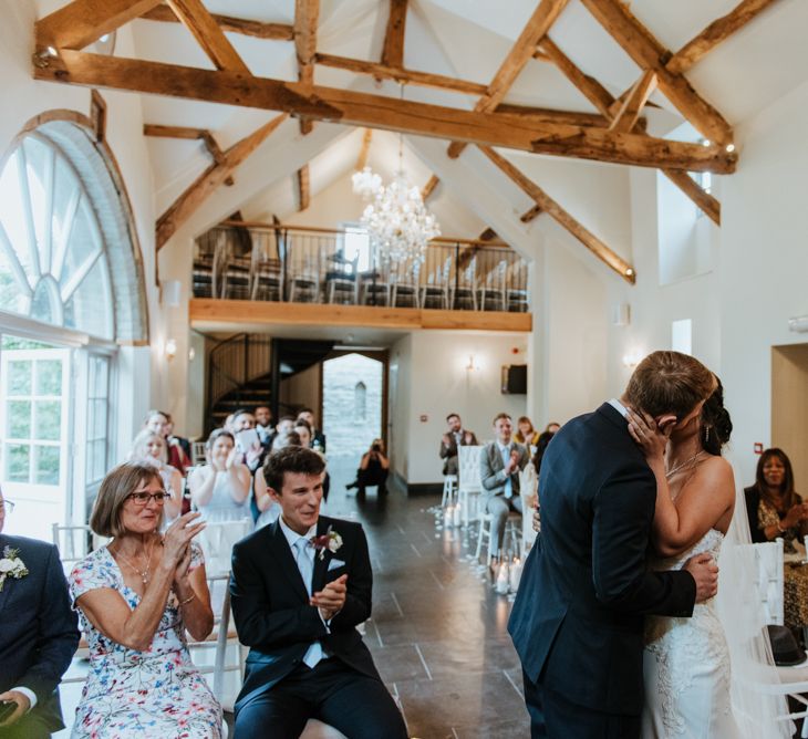 Bride and groom kissing at intimate Lemore Manor wedding