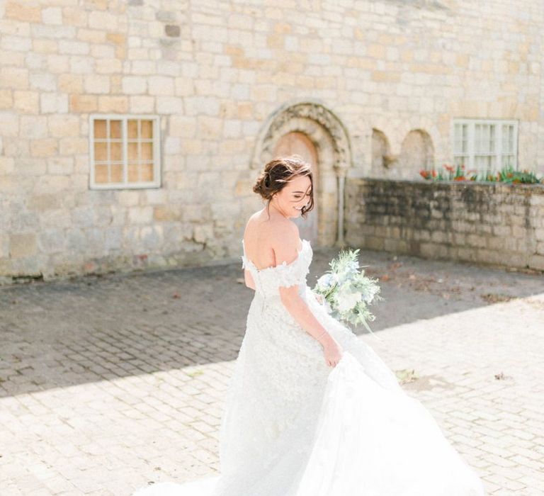 Bride in a Bardot Ian Stuart Wedding Dress with Appliqué Detail