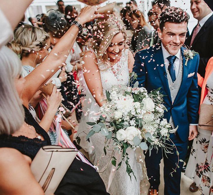 Confetti Moment | Bride in Lace Mikaella Bridal Gown | Groom in Navy Remus Uomo Suit &amp; Grey Waistcoat | Blush, Rustic Luxe Wedding at Ever After, Dartmoor | Dan Ward Photography | CupcakeVideos