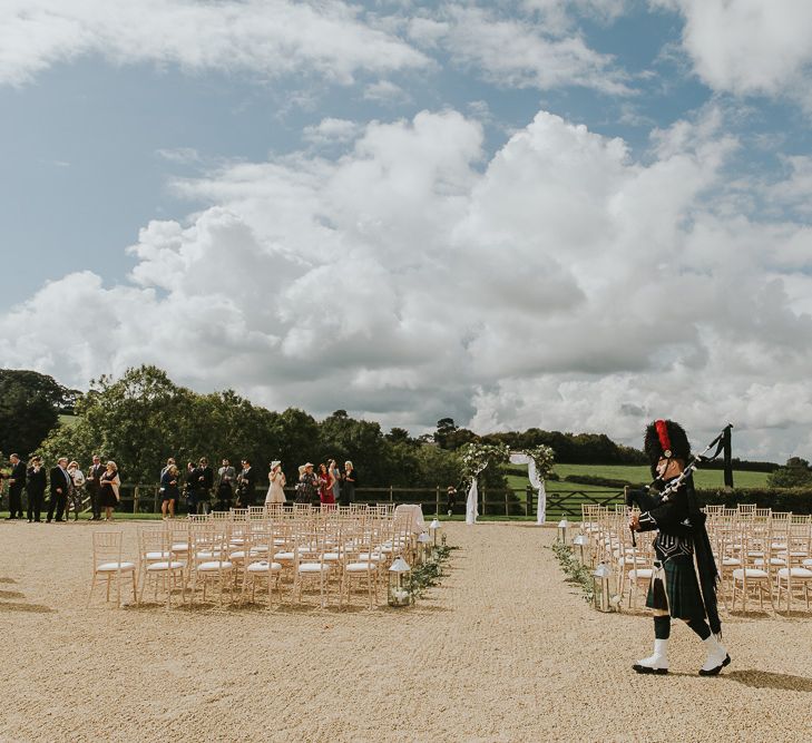 Scottish Bag Piper For Dorset Wedding // Scottish Wedding With Ceilidh At Axnoller Dorset With Bohemian Styling Outdoor Wedding Ceremony With Images From Paul Underhill Dorset Wedding Photographer