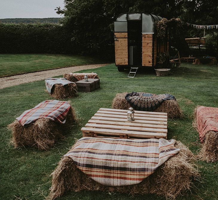 DIY Hay Bale Seating Area &amp; Horse Box Bar | English Country Garden Marquee Wedding at the Family Home on the Isle of Wight | Jason Mark Harris Photography