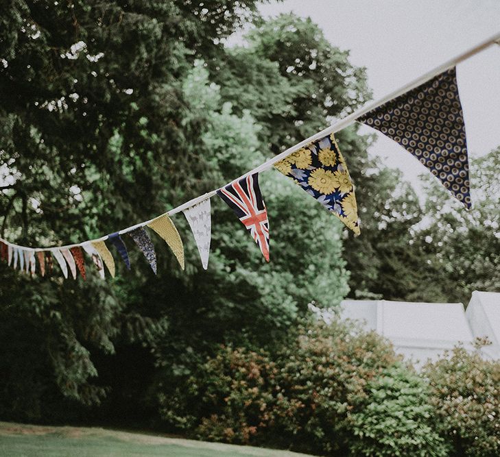 DIY Bunting Wedding Decor | English Country Garden Marquee Wedding at the Family Home on the Isle of Wight | Jason Mark Harris Photography