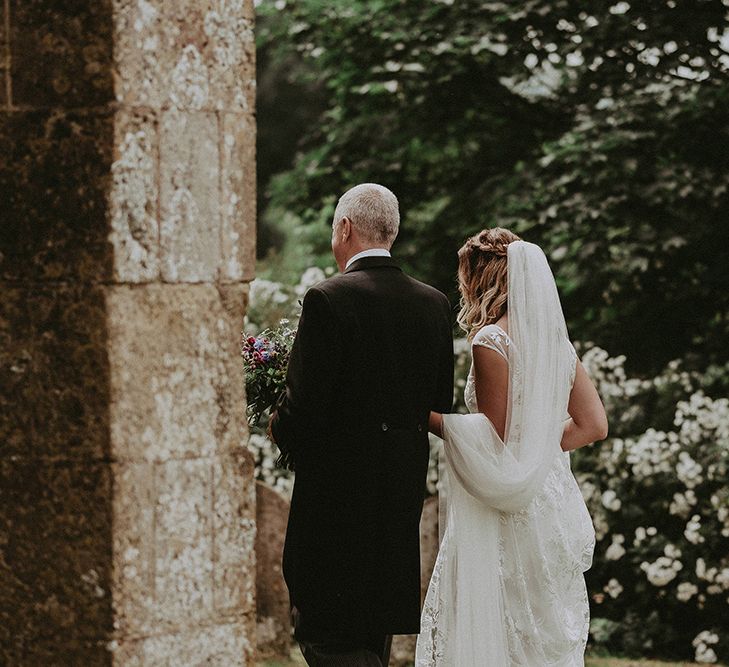 Bridal Entrance in LaceRime Arodaky Gown | English Country Garden Marquee Wedding at the Family Home on the Isle of Wight | Jason Mark Harris Photography