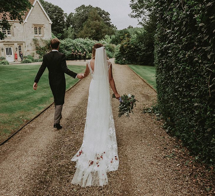 Bride in Lace Rime Arodaky Wedding Dress | Groom in Henry Herbert Tailors Suit | English Country Garden Marquee Wedding at the Family Home on the Isle of Wight | Jason Mark Harris Photography